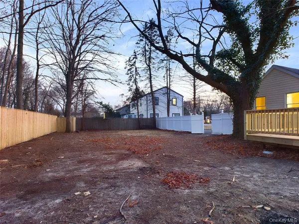 a view of a yard with a tree