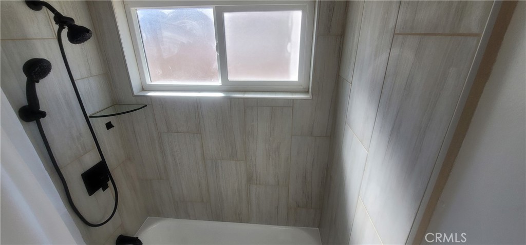 4136 Poplar Trail Frazier Park, CA 93225 - Photo 17 of 32 a bathroom with a window and a shower