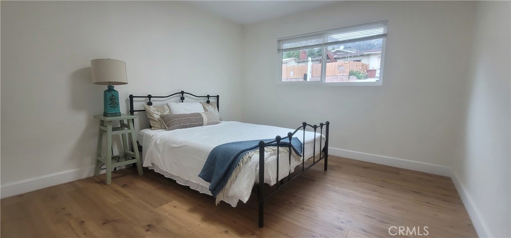4136 Poplar Trail Frazier Park, CA 93225 - Photo 24 of 32 a bedroom with a bed and a night stand