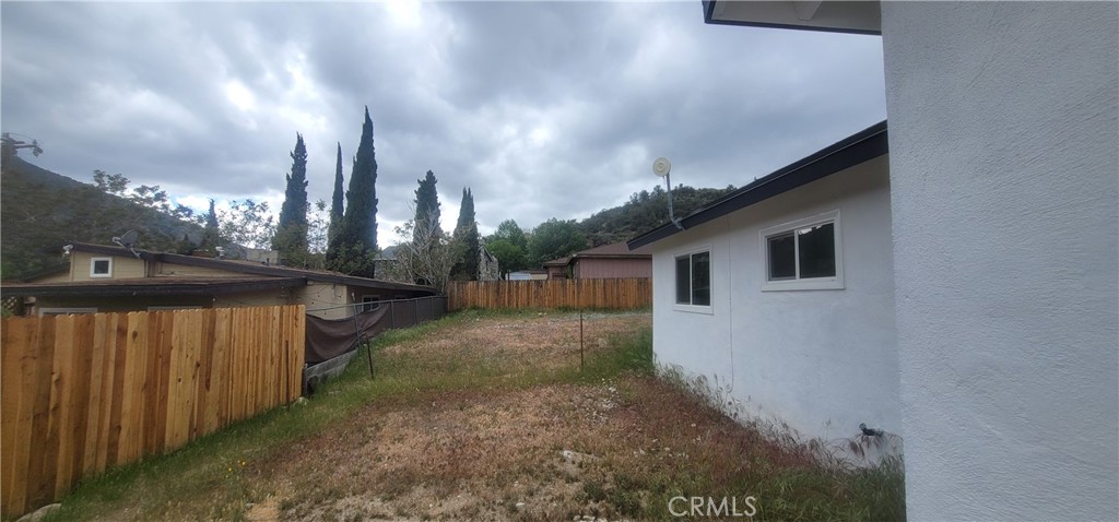 4136 Poplar Trail Frazier Park, CA 93225 - Photo 27 of 32 a view of a house with a backyard
