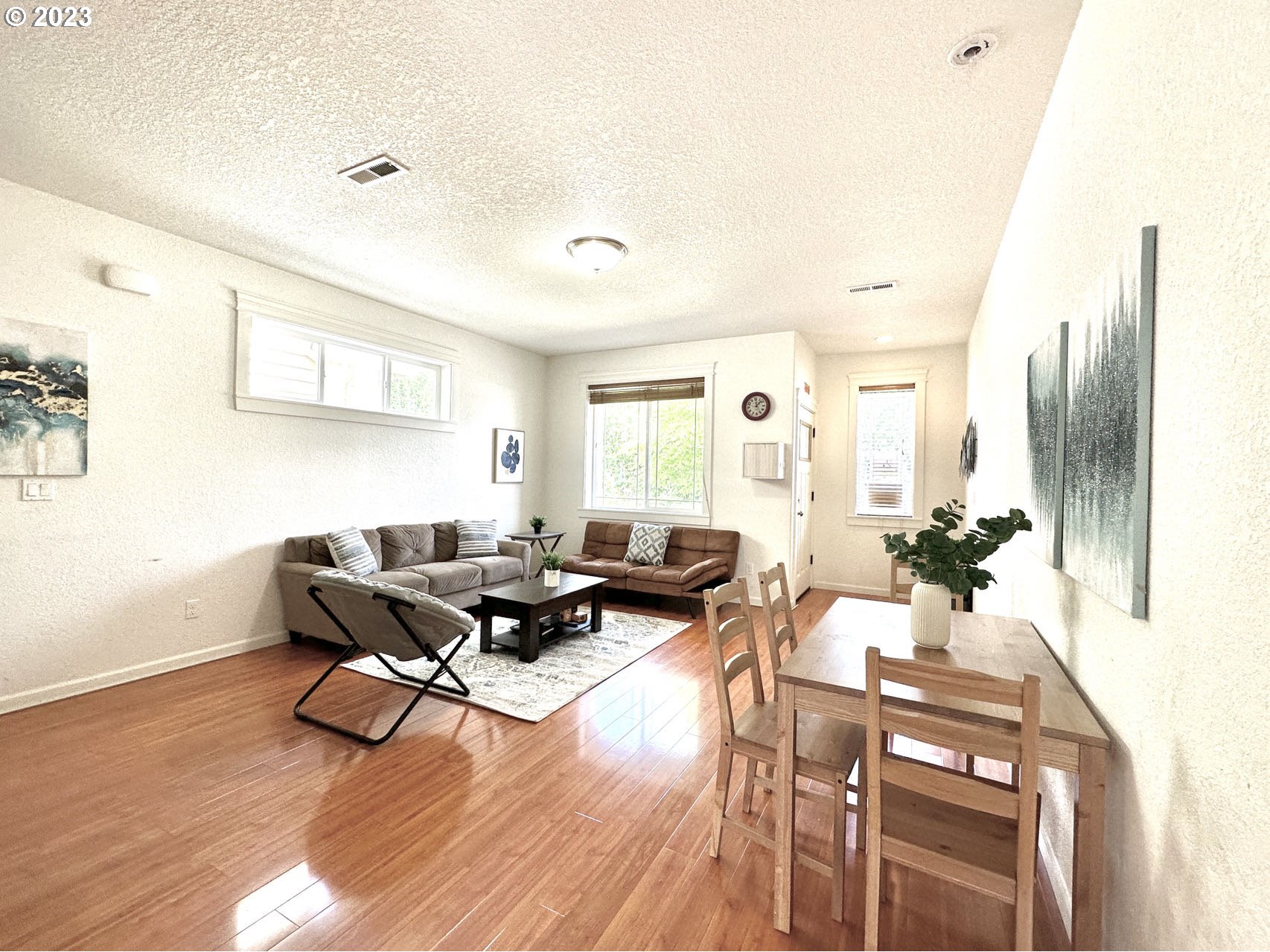 12428 Southeast Center Street Portland, OR 97236 - Photo 4 of 17 a living room with furniture stove and wooden floor