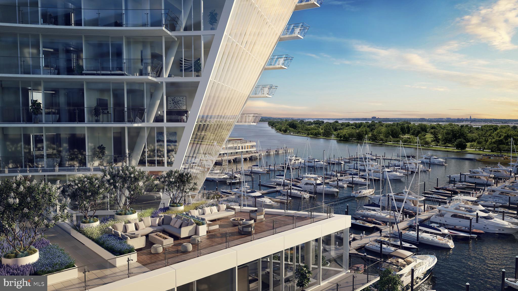 601 Wharf Street Southwest, Unit 806 Washington, DC 20024 - Photo 20 of 21 a view of a lake with tall buildings