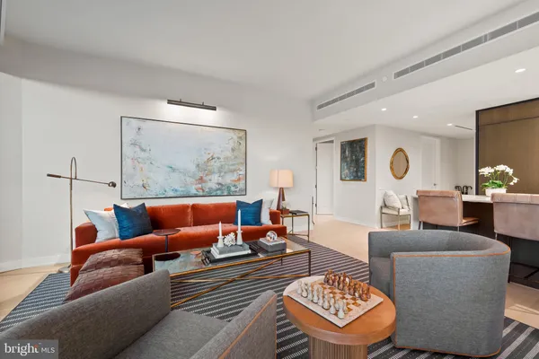 a living room with furniture and a rug