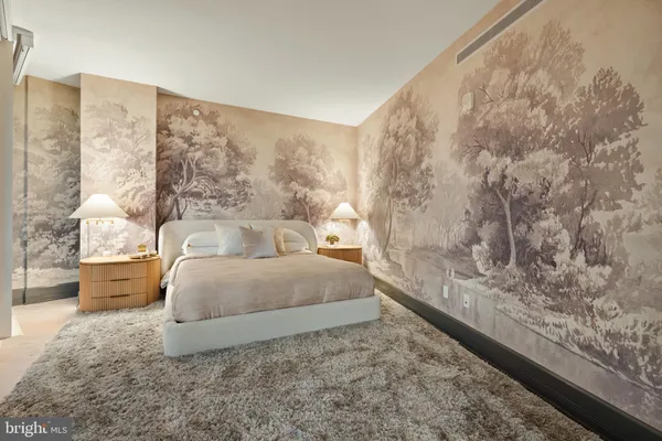 a spacious bedroom with a large bed and a couch