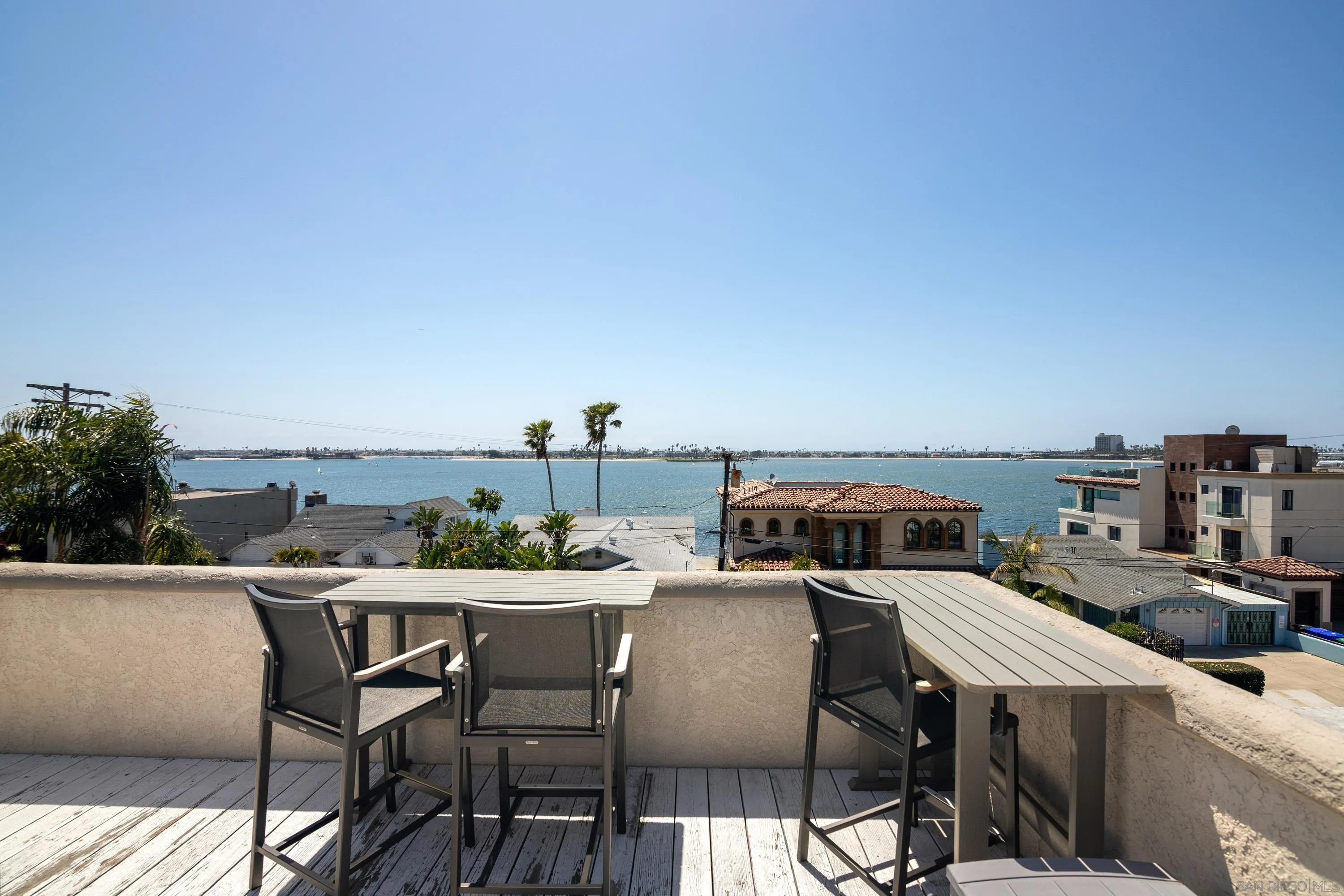 3701 Riviera Drive, Unit 11 Pacific Beach, CA 92109 - Photo 27 of 32 a view of a terrace with furniture and stove