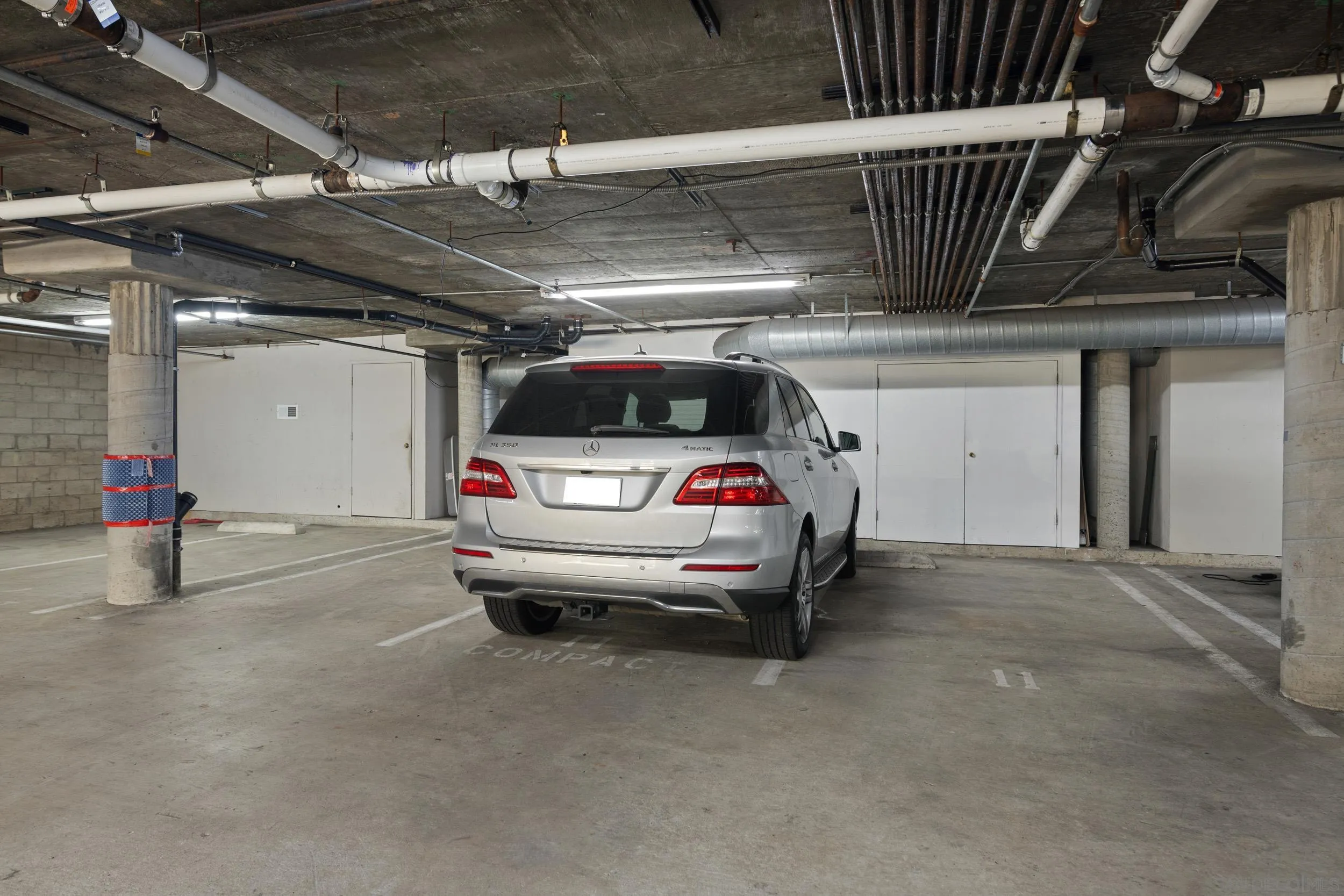 3701 Riviera Drive, Unit 11 Pacific Beach, CA 92109 - Photo 29 of 32 a view of parking garage with cars