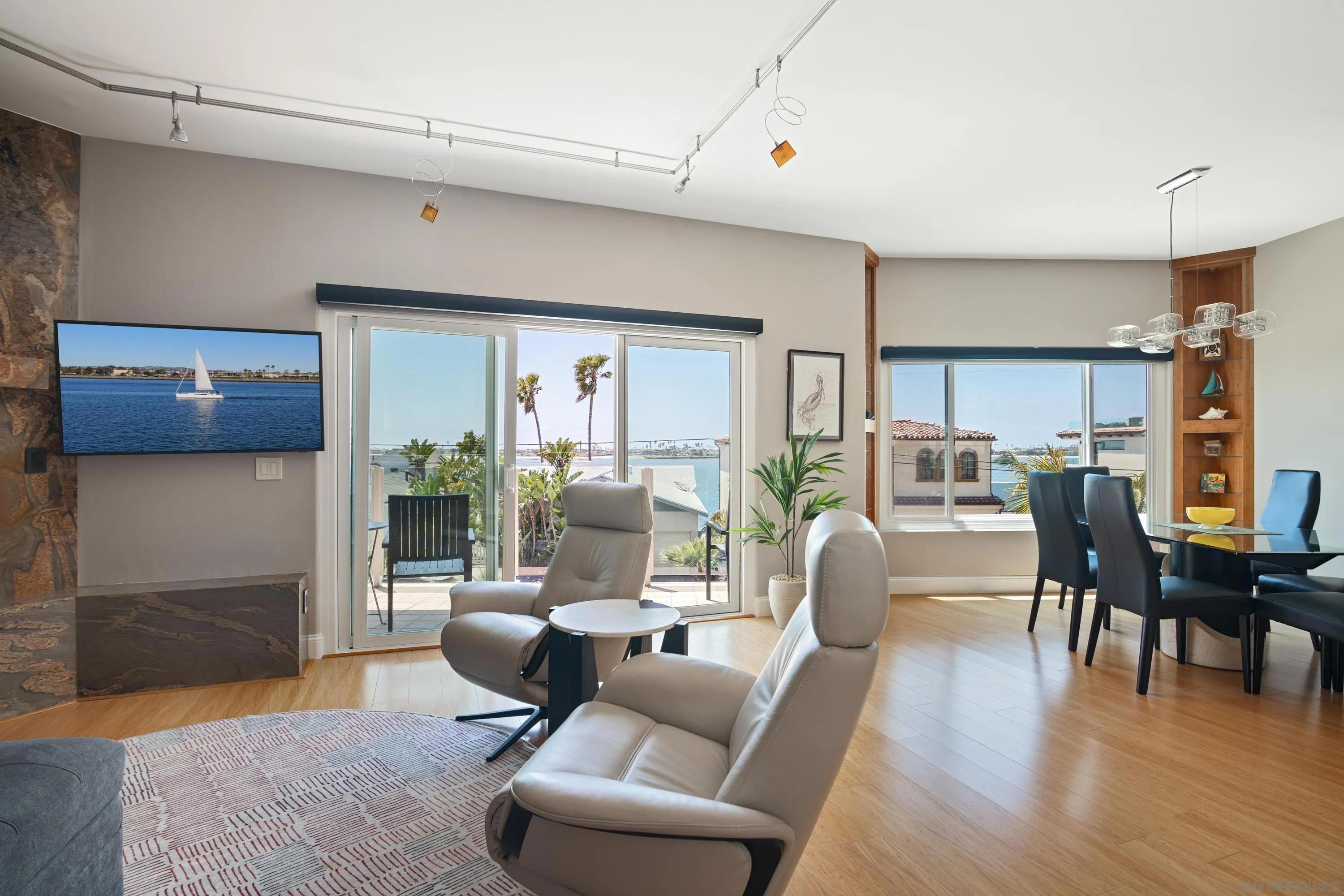 3701 Riviera Drive, Unit 11 Pacific Beach, CA 92109 - Photo 4 of 32 a living room with furniture wooden floor and kitchen view