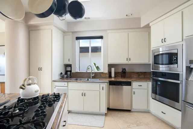 a kitchen with a stove and a sink