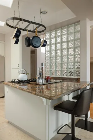 a kitchen with a table and chairs in it