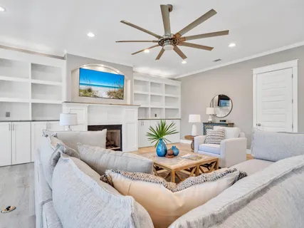 a view of a room with furniture and wooden floor