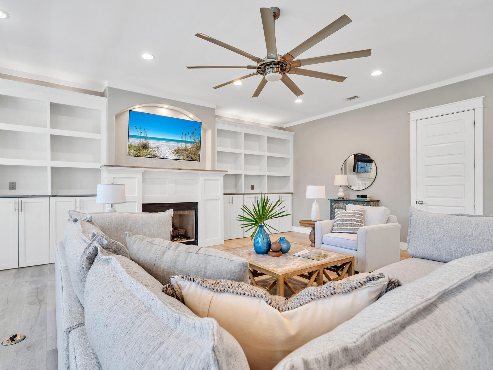 61 Sweet Breeze Drive Santa Rosa Beach, FL 32459 - Photo 16 of 92 a living room with furniture a fireplace and a flat screen tv