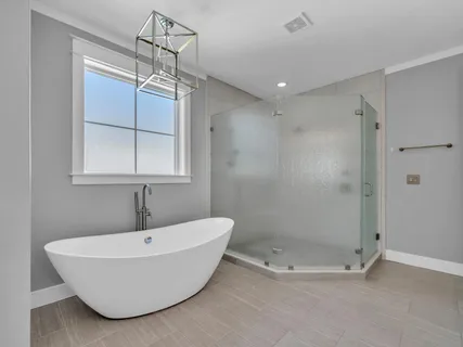 an aerial view of a house with swimming pool and garden