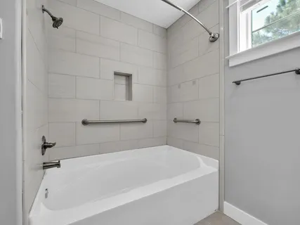 a view of swimming pool with a table and chairs under an umbrella