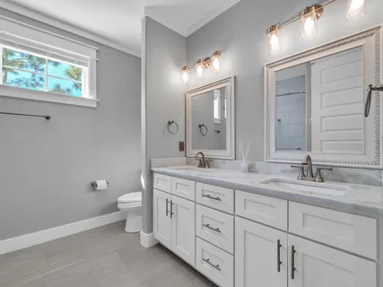 a view of a chair and table in backyard of the house