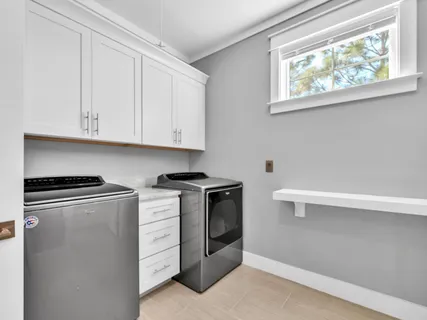 a view of a house with backyard porch and sitting area