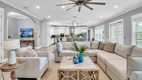 a view of a chair and table in backyard of the house