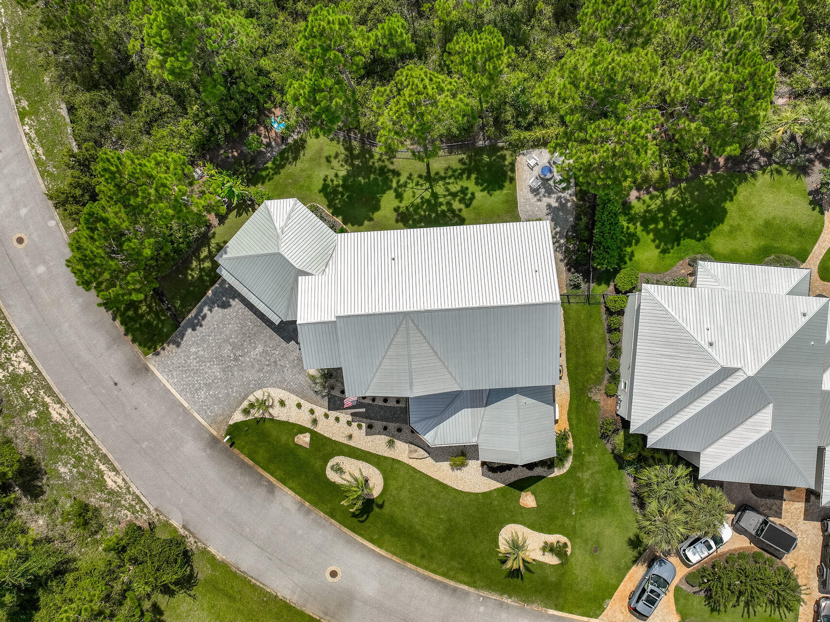 61 Sweet Breeze Drive Santa Rosa Beach, FL 32459 - Photo 73 of 92 an aerial view of a house with swimming pool and garden