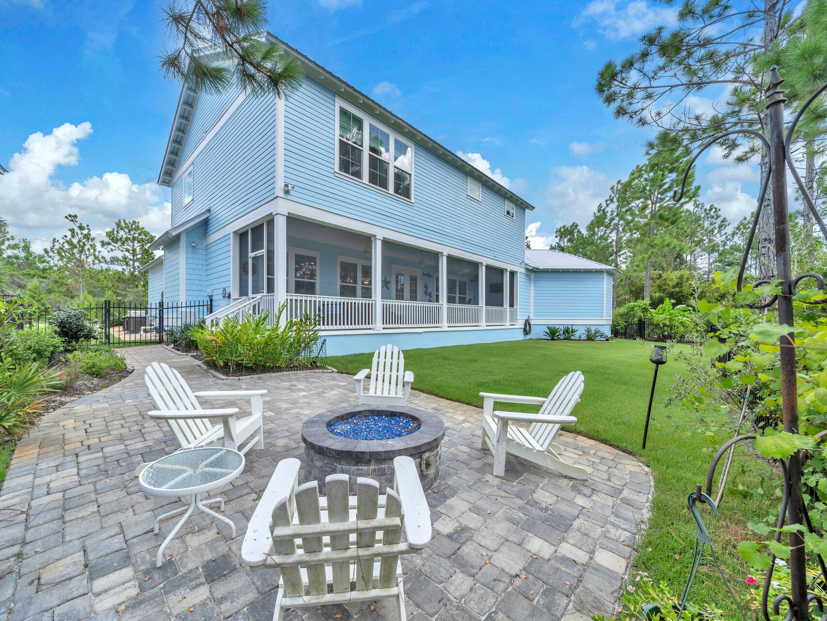 61 Sweet Breeze Drive Santa Rosa Beach, FL 32459 - Photo 80 of 92 a view of a chair and table in backyard of the house