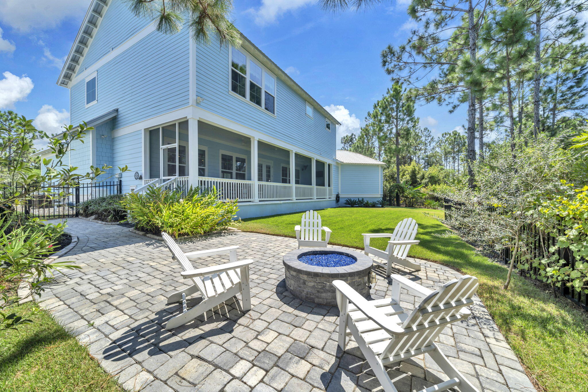 61 Sweet Breeze Drive Santa Rosa Beach, FL 32459 - Photo 8 of 92 a view of a chair and table in backyard of the house
