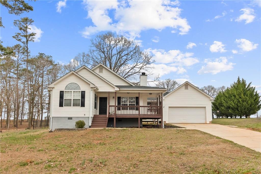 132 Millstone Drive Commerce, GA 30530 - Photo 1 of 1 a front view of a house with a yard and garage