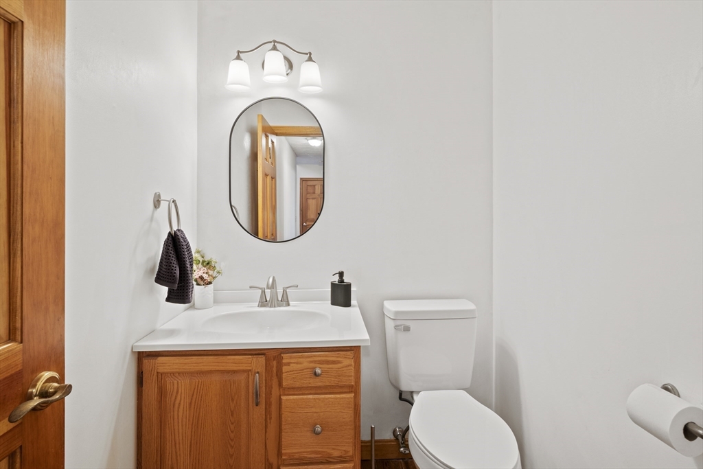 562 South Street Shrewsbury, MA 01545 - Photo 18 of 40 a bathroom with a toilet sink and mirror