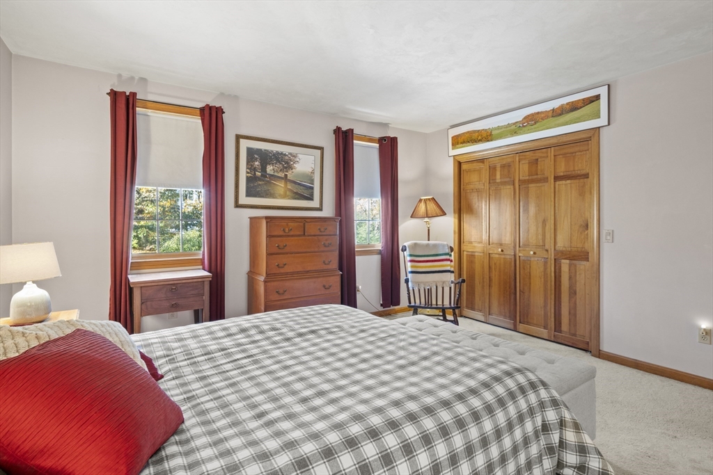 562 South Street Shrewsbury, MA 01545 - Photo 28 of 40 a bedroom with a bed and a lamp on dresser