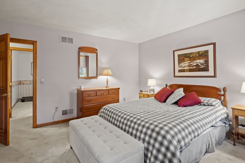 562 South Street Shrewsbury, MA 01545 - Photo 29 of 40 a bedroom with a bed and a painting on the wall