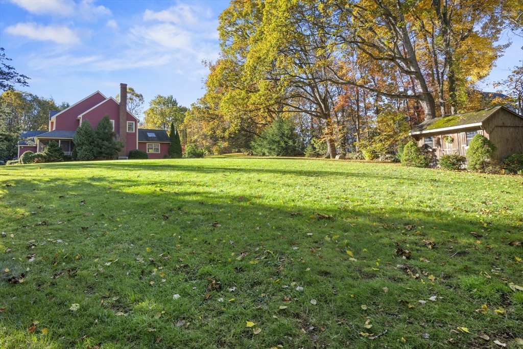 562 South Street Shrewsbury, MA 01545 - Photo 34 of 40 a front view of house with yard and green space