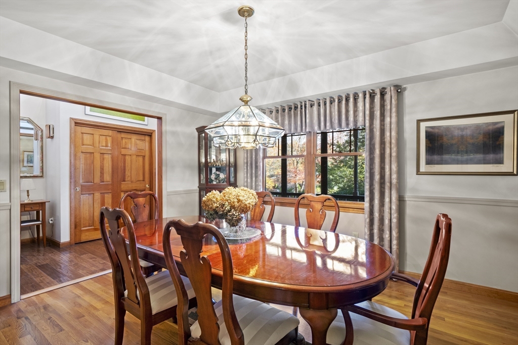 562 South Street Shrewsbury, MA 01545 - Photo 6 of 40 a dining room with furniture a chandelier and wooden floor
