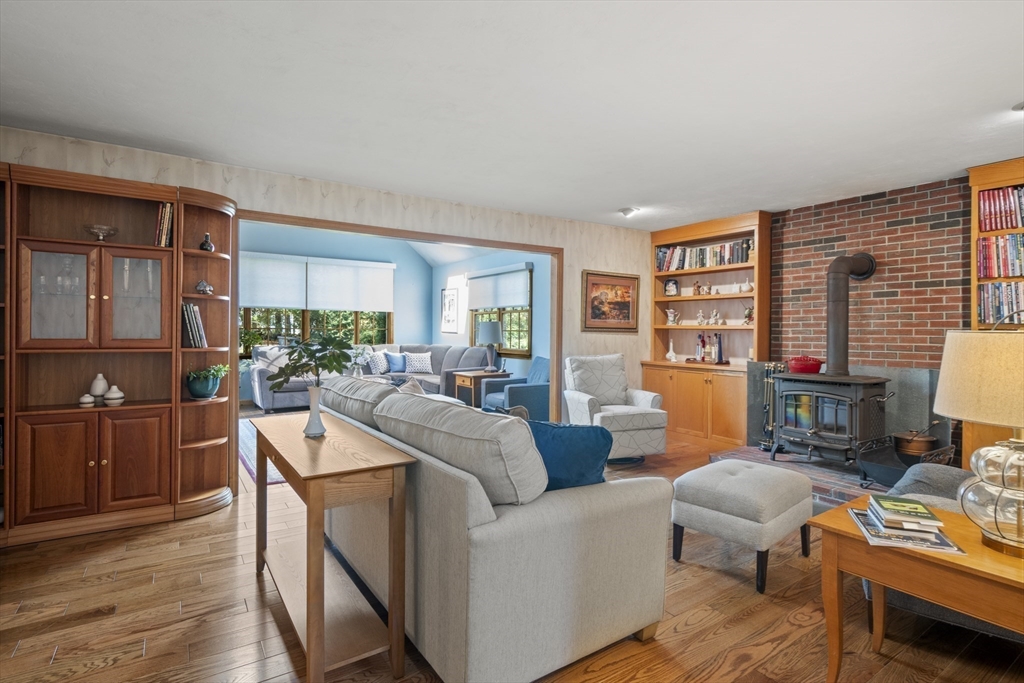 562 South Street Shrewsbury, MA 01545 - Photo 8 of 40 a living room with furniture and a dining table with wooden floor