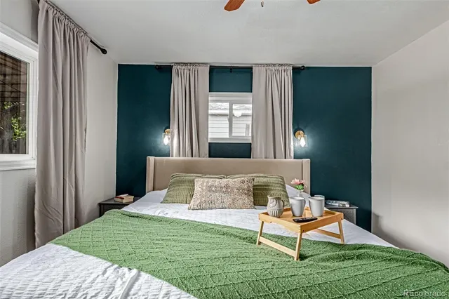 a bedroom with a bed and window