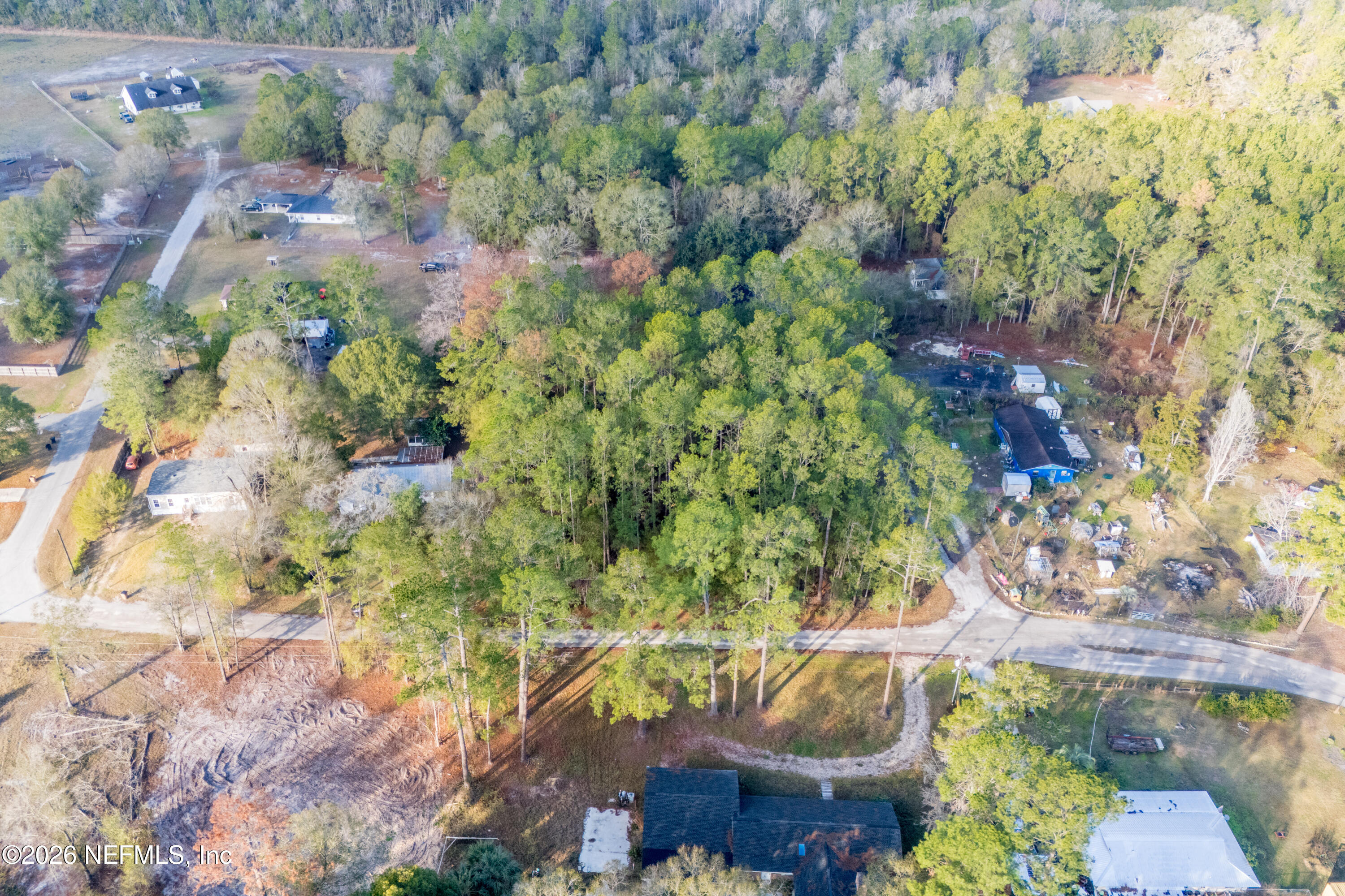 0 Northwest 56th Avenue Starke, FL 32091 - Photo 3 of 5 a backyard of a house with a yard and outdoor seating