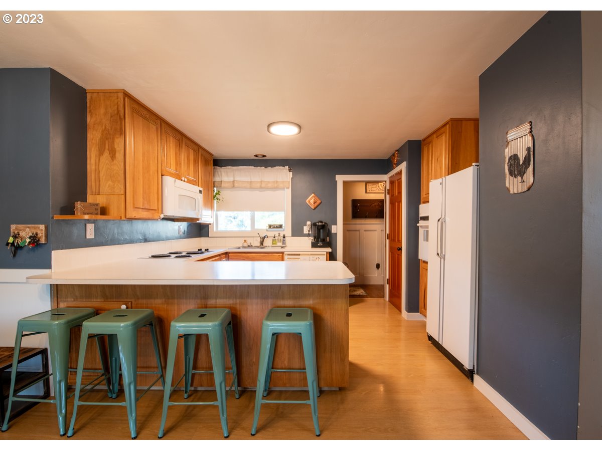 5279 Jasper Road Springfield, OR 97478 - Photo 6 of 48 a kitchen with cabinets and refrigerator