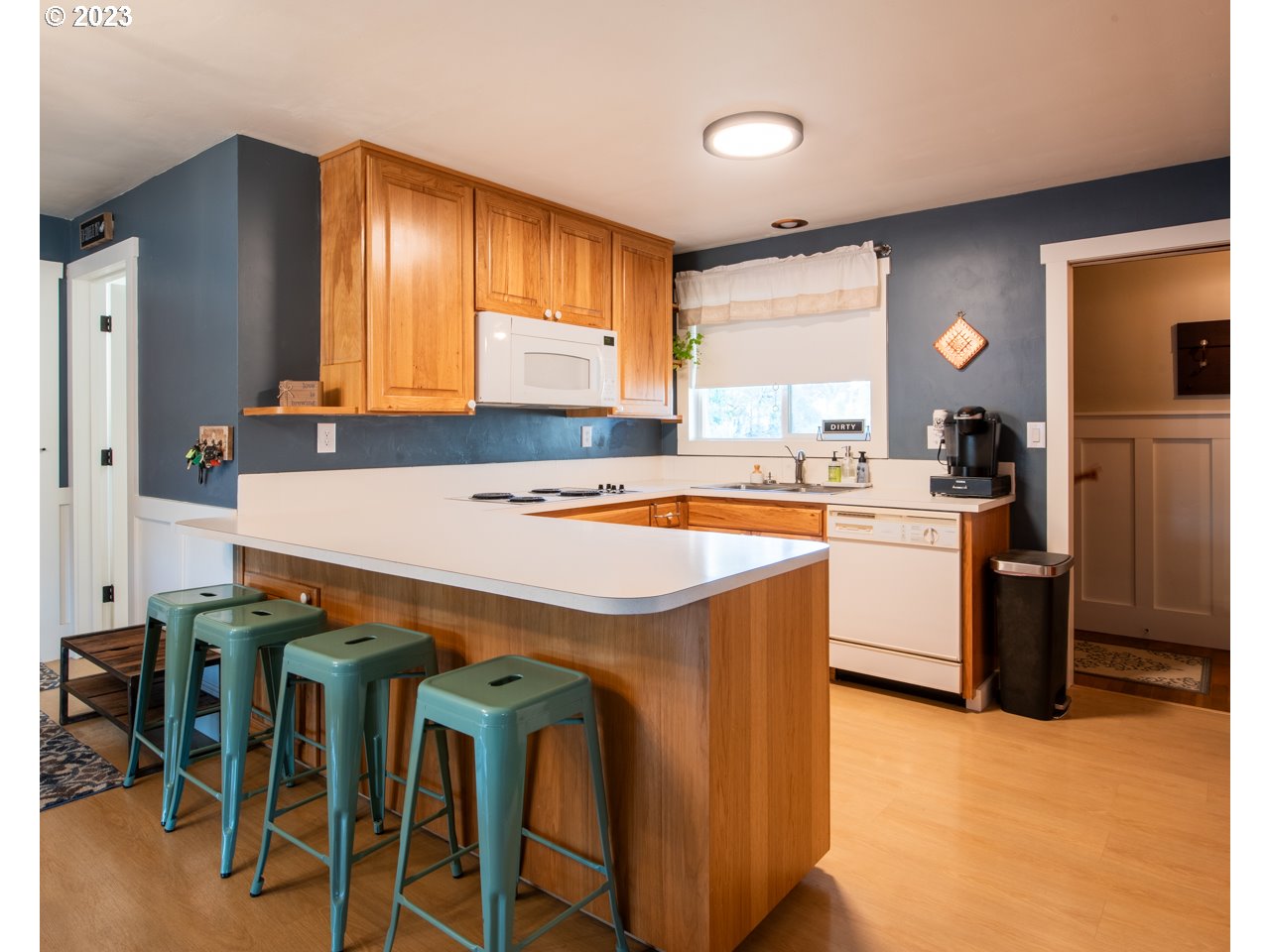 5279 Jasper Road Springfield, OR 97478 - Photo 7 of 48 a kitchen that has a sink stainless steel appliances a window and a counter top space