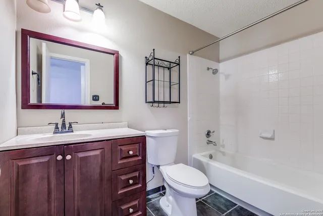 a view of a house with backyard sitting area and garden