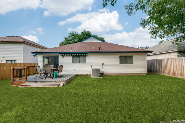 a view of a house with a yard patio and swimming pool