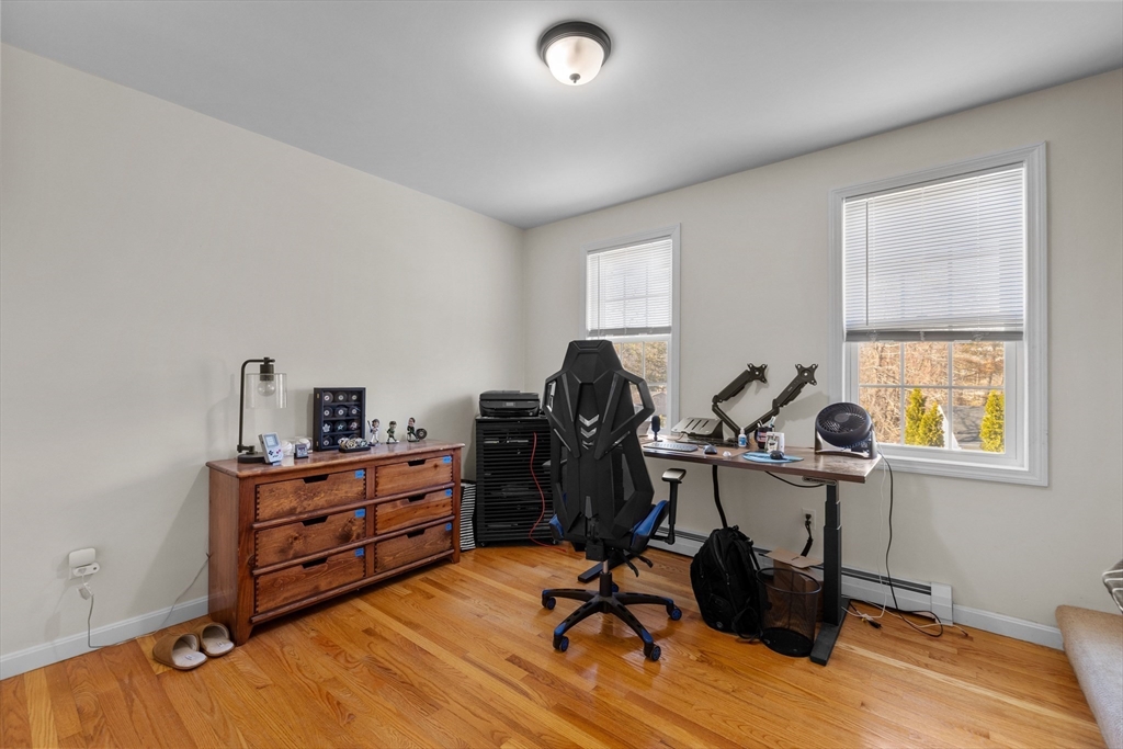 38 Brook Street Georgetown, MA 01833 - Photo 23 of 42 a view of workspace with wooden floor lounge chair windows cabinet