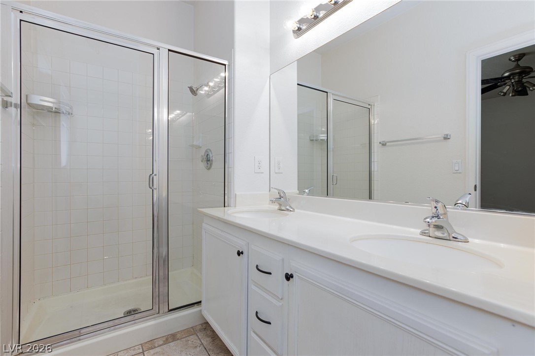 2246 Ramsgate Drive Henderson, NV 89074 - Photo 20 of 36 Double vanity and a spacious walk-in shower elevate this contemporary bathroom.