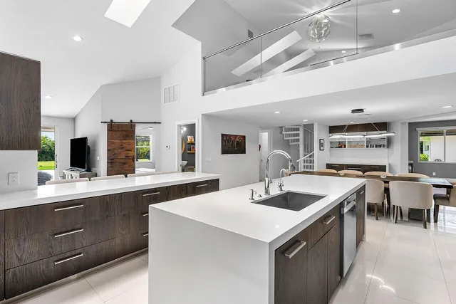 a kitchen with a sink and cabinets