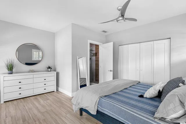 a bedroom with a bed and a dresser