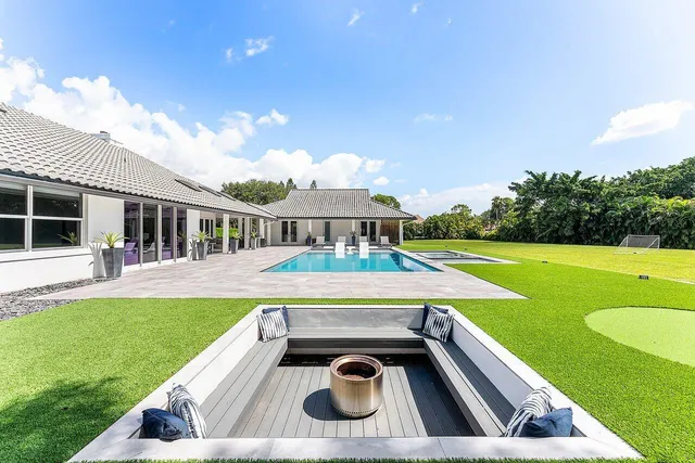 a view of a swimming pool with a patio