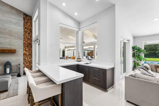 a kitchen with a stove a sink and a refrigerator