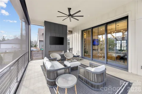a kitchen with stainless steel appliances a sink and a table
