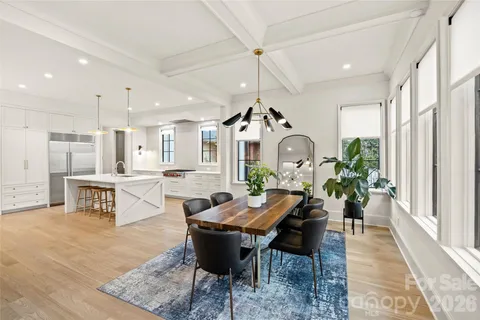 a bedroom with bed and a chandelier