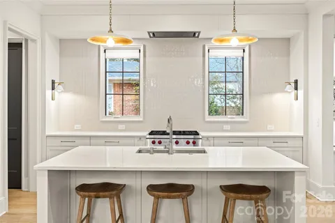 a bedroom with a large bed and a flat screen tv