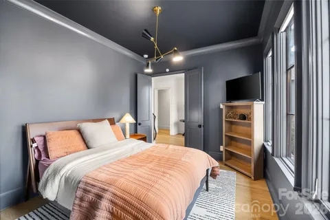 a bathroom with a toilet a sink and a view of bathroom