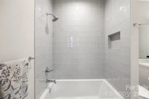 a view of a livingroom with furniture and a flat screen tv