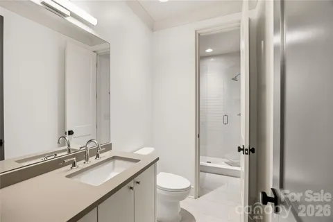 a front view of a house with a yard and outdoor seating