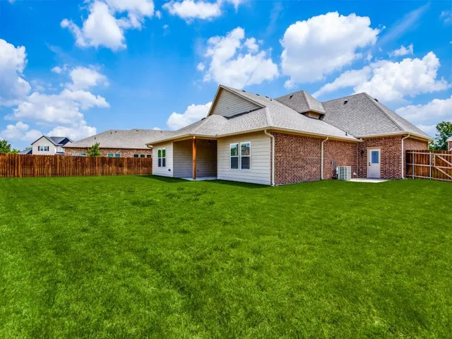 a view of a house with a yard porch and sitting area