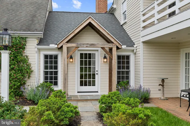 a view of a dining room with furniture wooden floor and a chandelier